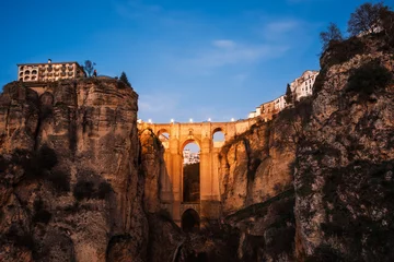 Foto auf Acrylglas Ronda Puente Nuevo Puente Nuevo (New Bridge) at twilight, Ronda, Andalusia, Spain. Built in 1793 to connect the old and the modern neighborhood of the city, it is the Ronda?s best recognized landmark.