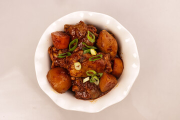 Dakdoritang is a Korean Red Spicy Braised Chicken Dish.