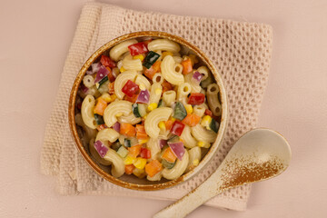 Macaroni Salad with Bell Pepper, Onion, Corn and Mayonnaise Dressing.