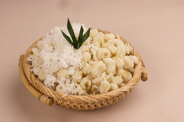 Binatog is Filipino Boiled Corn Dessert, made with White Hominy or Lagkitan or Kinulti Mais Top with Grated Coconut.