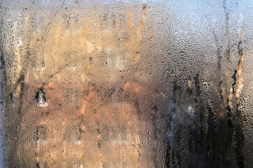 condensation on the glass. wet glass background.