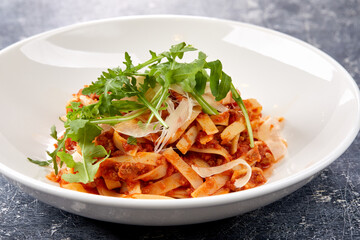 pasta bolognese on the white plate