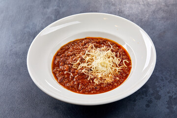 bean soup with parmesan on white plate