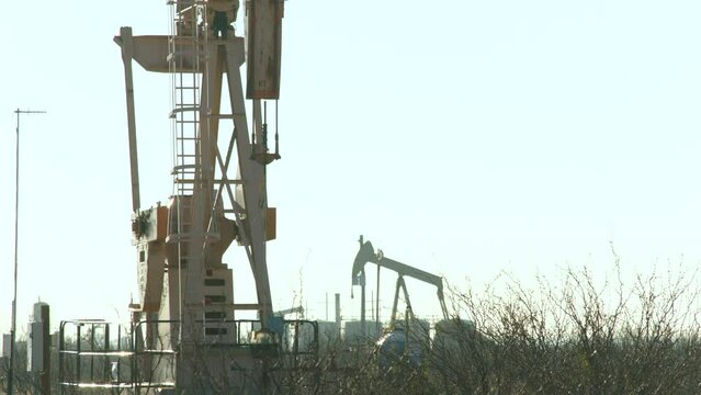 Oil well pumping in the Permian Basin. Pecos Texas January 2024.