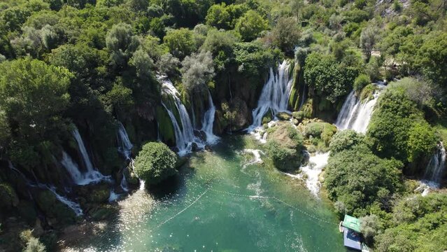 Aerial orbit Kravica Waterfall in Bosnia and Herzegovina, sunny summer day