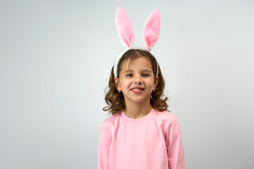 Obraz na płótnie Canvas Cute little child wearing bunny ears on Easter day