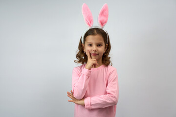 Cute little child wearing bunny ears on Easter day