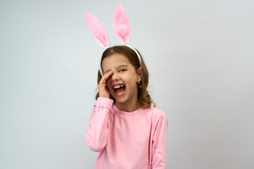 Cute little child wearing bunny ears on Easter day