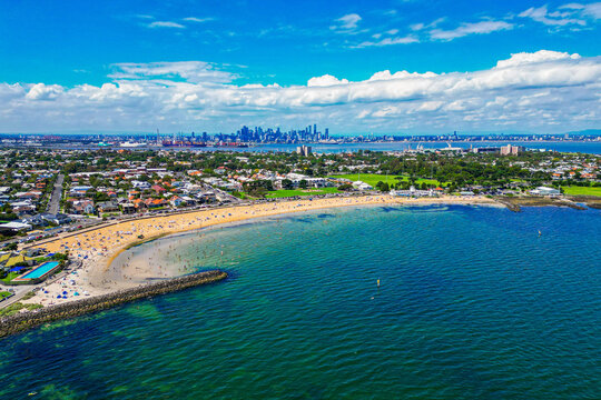 An Aerial view of Williamstown Beach with the Melbourne Skyline in the background on a Sunny Summers Day