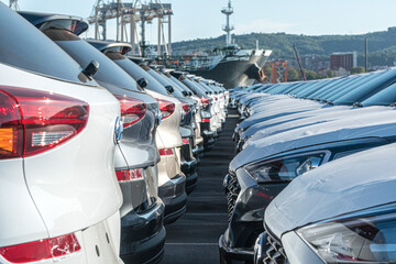 New cars waiting at the port before loading