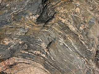 Detail of the formation of a rock with its layers of fragmented strata.
