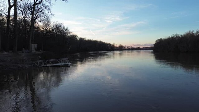 James river shoreline with trees and piers in cold winter morning.
