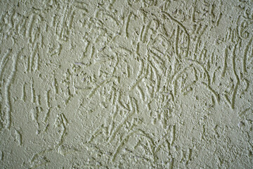 Close-up surface detail of old rough plaster wall texture.