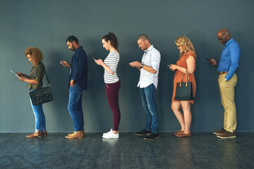 Obraz premium Businesspeople, hiring and waiting in line with technology or recruitment, onboarding or internet. Men, women and corporate diversity or cellphone in queue or interview, human resources or employment