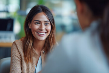 Obraz premium Happy businesswoman interviewing a well-prepared job candidate in a cozy office environment. The job interview process - from expectation to excitement, captured in high-definition