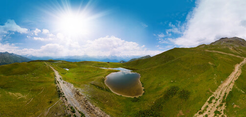 Aerial view at the Koruldi lakes. Green hills, high mountain pastures. Summer day. in the...