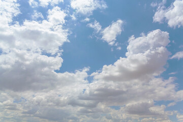 Fototapeta na wymiar Fluffy cumulus clouds on clear sky, nature atmosphere background