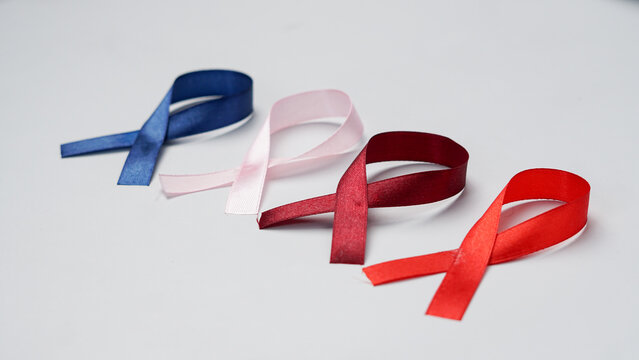 Colorful ribbons on white background, World Cancer Day - Powered by Adobe