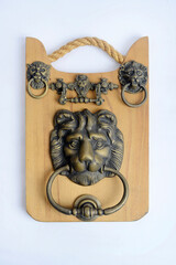 Antique door handle and door knocker, made of brass