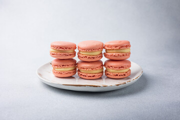 Orange macaroons with yellow filling. Close up