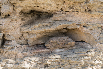 Fragment of a dilapidated medieval stone wall.