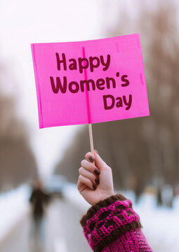 Naklejki female hand holds a pink flag with the inscription Happy Women's Day, feminism, March 8, equality, holiday, demonstration, congratulation, fight for rights, street, text, lettering