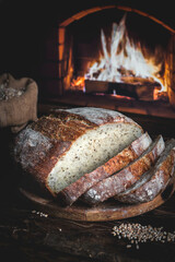 Homemade bread on the background of a home hearth