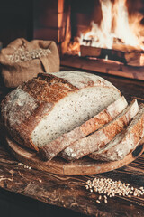 Homemade bread on the background of a home hearth