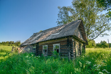 Fototapeta na wymiar Ruined house in abandoned Russian village