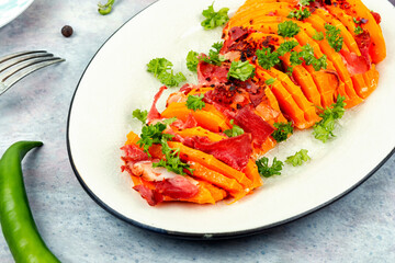 Baked pumpkin or squash with bacon.