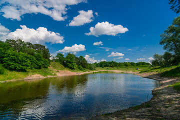 lake in the forest and clouds
