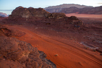Wadi Rum Desert in Jordan. On the Sunset. Panorama of beautiful sand pattern on the dune. Desert landscape in Jordan. Travel concept. Freedom