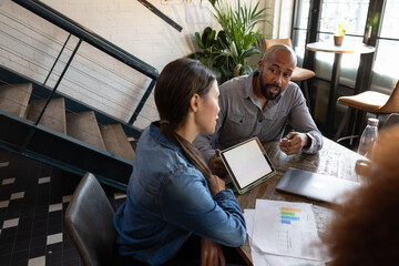 African American businessman giving a presentation in a business meeting