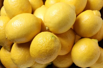 Many fresh lemons as background, top view