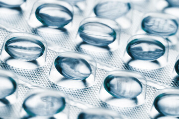 Big pharma metal tablet blister. White pills medicine. Silver shiny blister with drugs. White color...