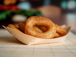 Crispy Delicious Fried Calamari Rings in a Bowl on the Table
