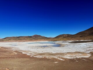 Laguna Miscanti is a brackish water lake located in the highlands of the Antofagasta region, in northern Chile. The Cerro Miñiques and Cerro Miscanti volcanoes tower over this lake.
