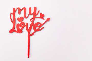The word my love in wooden red letters on white background. Valentine's day concept