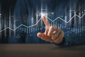 Businessman pointing  financial graph for business investment growth. Financial, data analysis,...