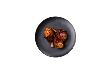 Delicious grilled chicken legs with spices and herbs in teriyaki sauce