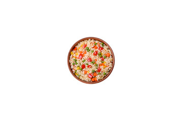 Delicious white boiled rice with vegetables, sweet peppers, carrots, peas