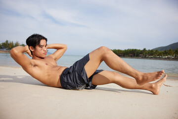 Muscular Asian Athlete Enjoying Beach Sunset Run in Healthy Lifestyle Portrait