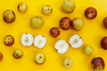 Fresh jujube fruit on yellow background