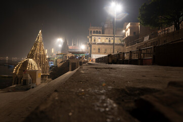  Varanasi  India  10 December 2023 Night view of tilted kashi karvat temple on scindia ghat at...