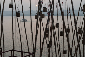  India 10 December 2023 Early in the Morning Bamboos are tied on the banks of river Ganga to celebrate the Akash Deep festival at Panchganga Ghat Varanasi Uttar Pradesh....