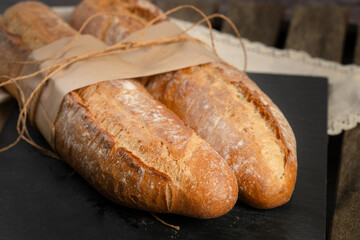 Two Baguettes on Wooden Table