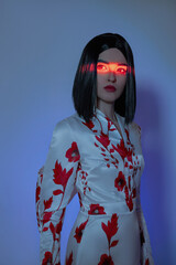 Woman with short black hair in a long Japan style dress, red glow