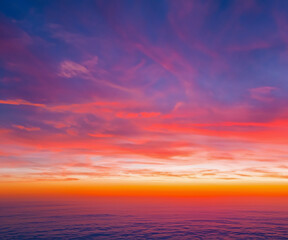 Fototapeta premium Ideal for Sky replacement project: colorful pink-orange-blue dramatic sky with clouds illuminated by red sunset, aerial photography, far horizon without obstacles.