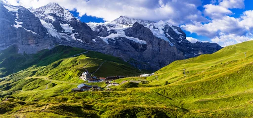 Gordijnen amazing Swiss nature . Kleine Scheidegg mountain pass  famous for hiking in Bernese Alps. view of highest peaks Eiger , Monc and Jungfrau, Switzerland travel © Freesurf