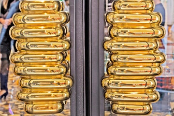 gilded door handles in a clothing store. Fashion & Style